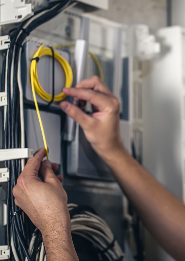 A person doing cable management