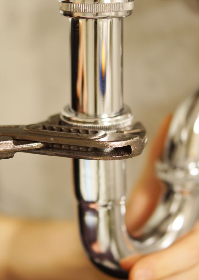 Plumber fixing a sink